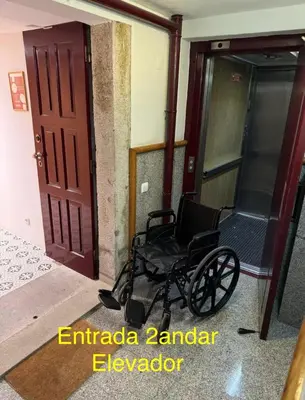a black wheelchair in front of a door at Luxury stay Premium Douro River & Sunset views in Porto