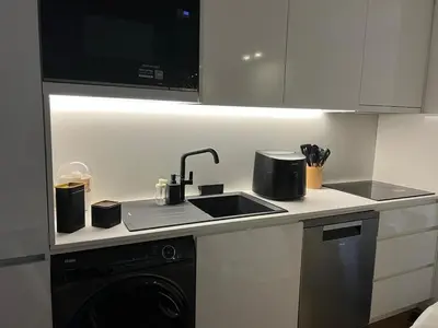 a kitchen with a sink and a stove at OPO Vale Formoso III Balcony&BBQ in Porto