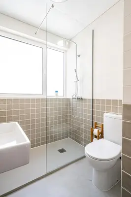 a bathroom with a toilet and a sink and a shower at The Flat in Porto