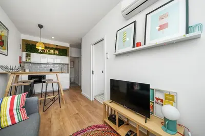 a stairway with a brown door and a stair case at Constituição Flat by Amber Star Rent in Porto