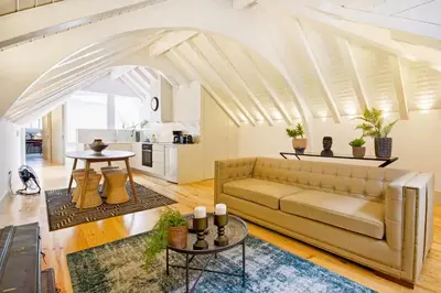 a living room with a couch and a table at Mouzinho 202 in Porto