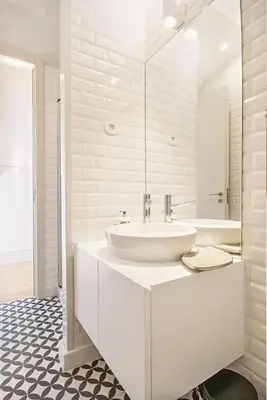 a white bathroom with a sink and a mirror at Mouzinho 202 in Porto