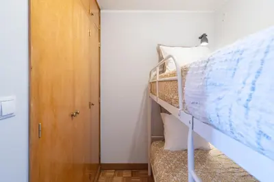 a bedroom with a bunk bed and a closet at Host Wise - Fantastic Peaceful Flat in Gaia in Vila Nova de Gaia