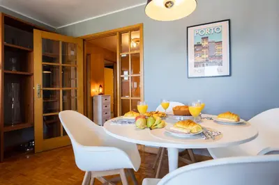 a dining room with a white table with food on it at Host Wise - Fantastic Peaceful Flat in Gaia in Vila Nova de Gaia