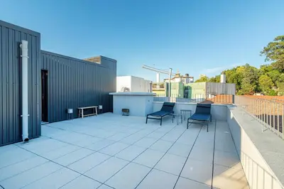 a patio with two chairs and a table on a building at Large Terrace in Paraiso III in Porto