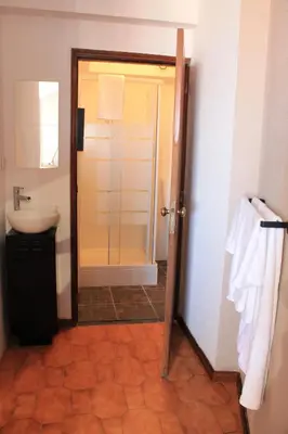 a bathroom with a shower and a sink and a toilet at Jardim do Morro Places in Vila Nova de Gaia