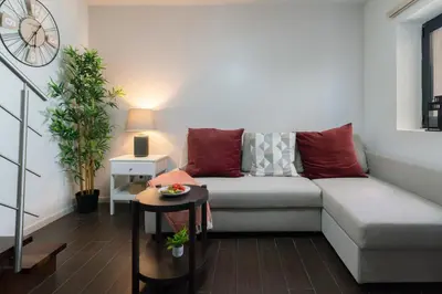 a living room with a couch and a table at Host Wise - Impressive Restful Houses in Porto