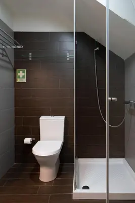 a bathroom with a toilet and a shower at Host Wise - Impressive Restful Houses in Porto