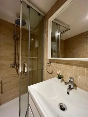 a bathroom with a sink and a shower at Casas da Corujeira in Porto