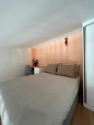 a bedroom with a large white bed in a room at Casas da Corujeira in Porto