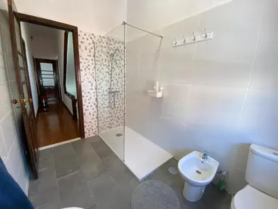 a bathroom with a toilet and a glass shower at BREINER 54 in Porto