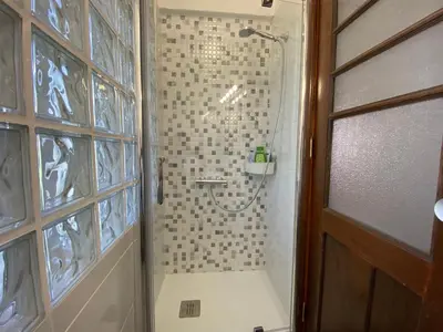 a bathroom with a shower with a glass door at BREINER 54 in Porto