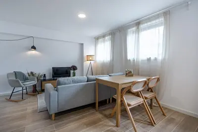 a living room with a couch and a table at Nomads Lux - 1BDR Charming Top Floor Porto in Porto