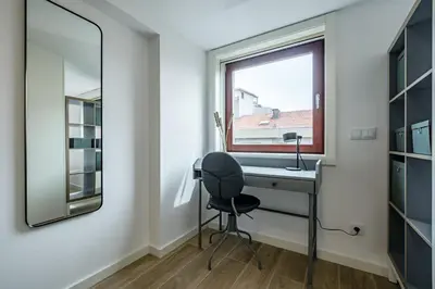 a bathroom with a desk and a window at Nomads Lux - 1BDR Charming Top Floor Porto in Porto