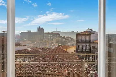 a view of a city from a window at Host Wise - Lovely Shinny Flats with Balcony - Clerigos in Porto