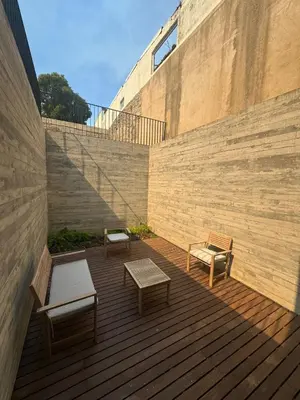 two benches on a wooden deck with a staircase at Nomad's Lux - Almada Apartments Porto in Porto