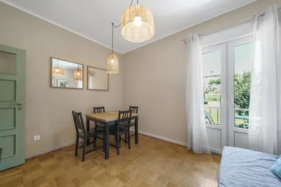 a dining room with a table and chairs at New Apartments Luiz I Bridge by Amber Star Rent in Vila Nova de Gaia
