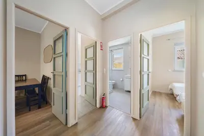 a hallway with two doors and a room with a desk at New Apartments Luiz I Bridge by Amber Star Rent in Vila Nova de Gaia