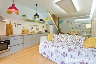 a living room with a couch and a kitchen at Host Wise - Comfortable Stunning Flats - City Center in Porto