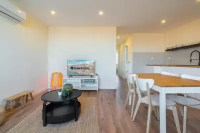 a kitchen and dining room with a table and chairs at Host Wise - Fantastic Contemporary Flat w Balcony in Porto
