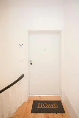 a large white door with a home sign on it at Liiiving in Porto - Urban Art Apartment in Porto