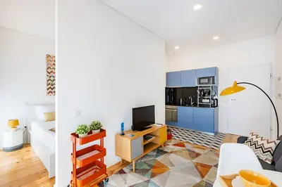 a white bedroom with a bed and a mirror at Oporto Urban Mood in Porto