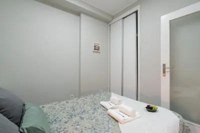a room with a table with towels on it at Host Wise - Modern Flats with Stunning Terrace or Balcony - Central Location in Porto