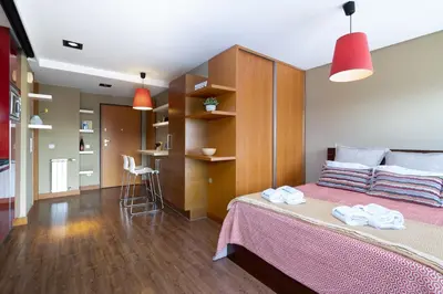 a bedroom with a bed with two towels on it at Host Wise - Bright Fresh Flat with Garage - Marquês in Porto