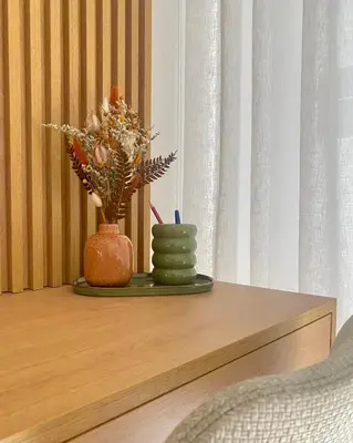 a table with two vases and a plant on it at My Home is Yours in Porto