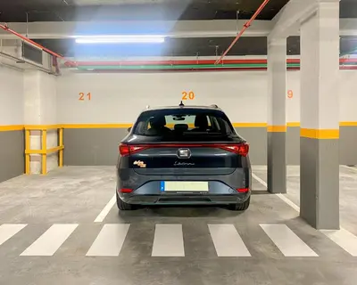 a car is parked in a parking garage at My Home is Yours in Porto