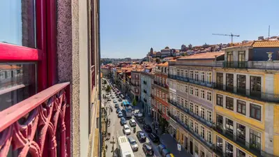 a view of a city street with cars and buildings at Bento Living by LovelyStay in Porto