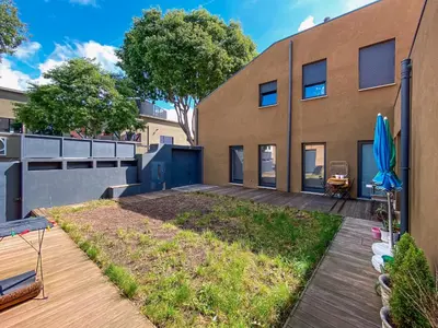 a house with a garden in front of a building at Casas S. Dinis in Porto