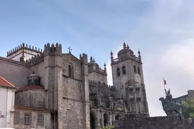 an old building with a clock tower on it at Loft in the historic center of Oporto downtown in Porto
