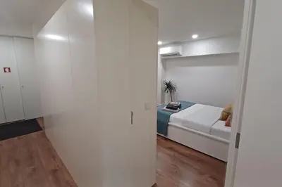 a room with a couch and a bed in it at A H - Apartment Oporto Downtown in Porto