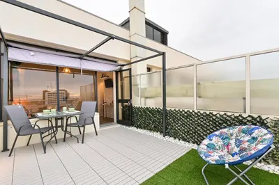 a balcony with a table and chairs on a building at Julio Dinis Porto Secret Retreat - by Guest SPA in Porto