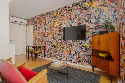 a living room with a colorful wall at Theater Studio in Porto