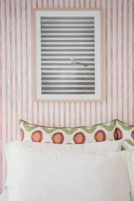 a bedroom with a bed with a picture on the wall at Allegro Boutique Apartments by Liiiving in Porto