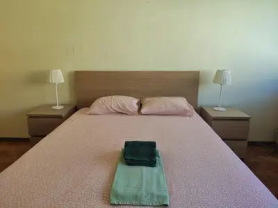 a bedroom with a bed with a bag on it at DISCOVER PORTO - Boavista 3 in Porto