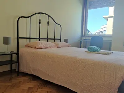 a bedroom with a bed and a window at DISCOVER PORTO - Boavista 3 in Porto