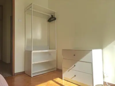 a white closet with a glass cabinet in a room at DISCOVER PORTO - Boavista 3 in Porto