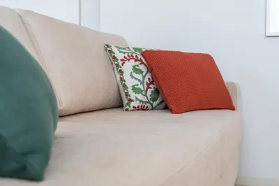 two pillows sitting on top of a couch at BONFIM LIVING - Great location, al fresco dining and free private parking in Porto