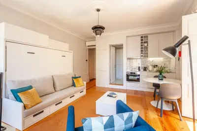 a living room with a couch and a table at D&S - Palácio dos Príncipes in Porto