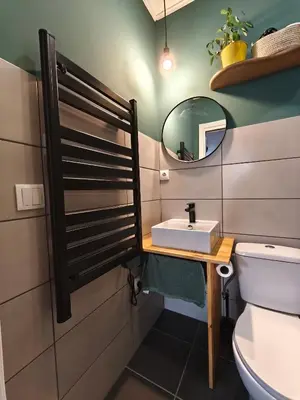 a bathroom with a sink and a mirror at Gaia Style Room in a Shared Apartment in Vila Nova de Gaia