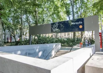a sign in front of a building with trees at Apartment with Private Garden in Porto