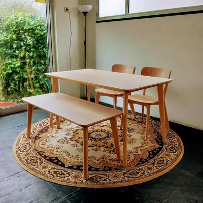 a table and two chairs on a rug with a table at Apartment with Private Garden in Porto