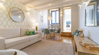 a living room with a couch and a table at Downtown PortoEdition in Porto