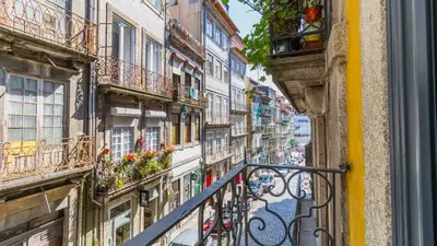 a view of a city street from a balcony at Downtown PortoEdition in Porto