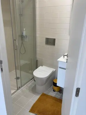 a bathroom with a shower and a toilet and a sink at GuestReady - Serene stay in Porto in Porto