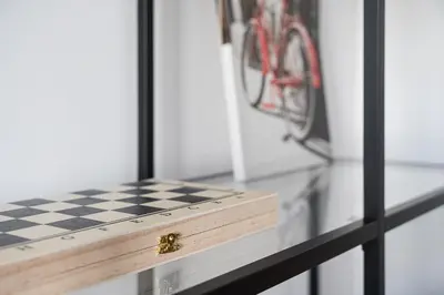 a black and white checkered table with a bike in the background at GuestReady - Serene stay in Porto in Porto