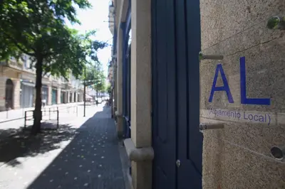 a building with aale sign on the side of a street at Nº 91 - Almirante Guest House in Porto